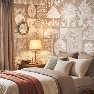 A luxury bedroom featuring the Geet Madhubani mural in clay beige behind a bed with terracotta and neutral linens view-bedroom