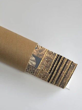 Premium rolled packaging of the Geet Madhubani wall art emerging from a protective kraft shipping tube