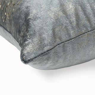 Close-up of the cushion corner showing the crushed grey velvet and metallic texture.