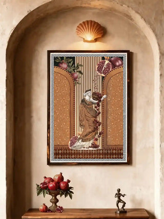 Framed Gilded Mythos wall art in amber ochre hung inside a plastered arched alcove above a wooden console with a brass fruit bowl and bronze figurine.