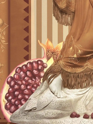 Close-up detail of the Gilded Mythos wall art in amber ochre, showing the ruby seeds of a halved pomegranate against fringed drapery and hand-painted stripes.