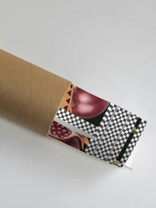 Gilded Mythos wall art in amber ochre in its rolled packaging, slipped into a kraft shipping tube for safe delivery.