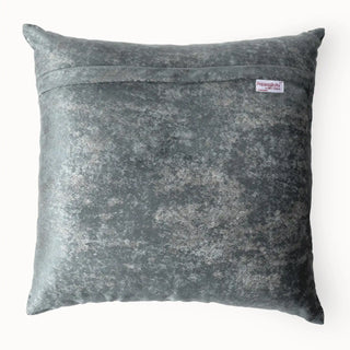 Back view of the cushion cover showing the solid grey metallic-effect velvet backing and zipper.