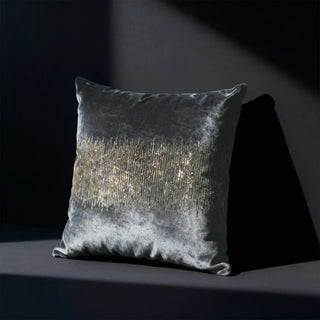 Single Golden Pulse Cushion Cover displayed on a dark surface, highlighting the metallic beading.