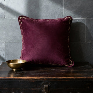 Single Golden Scallop Velvet Cushion styled on a dark chest with a gold bowl.