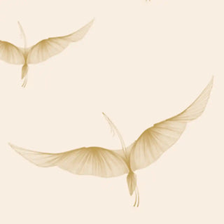 A close-up highlighting the soft golden textures and feather-like abstract detailing of the wing motifs.