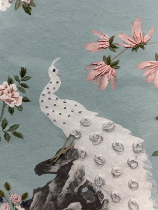 A detailed macro close-up of the Grace Embrace embroidered wall art showing the white peacock with small beads on its neck and silver thread loops on its tail.