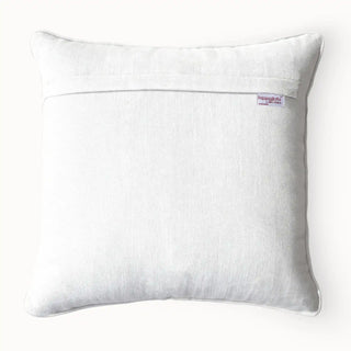 Back view of the cushion cover showing the plain white linen-look backing and concealed zipper.