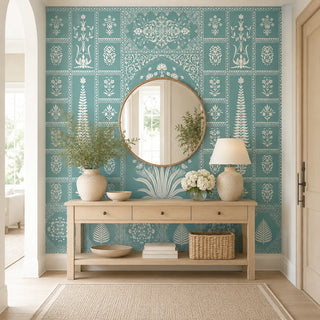 Gul Mughal wallpaper styled in an entryway with a round mirror, console table, and neutral accessories view-foyer