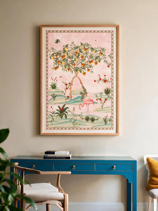 The Gulbiya Chinoiserie wall art in Blush Pink, framed and hung view-workspace above a blue console desk and wooden chair.