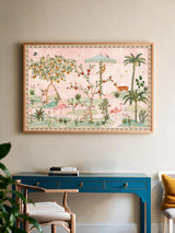 The Gulbiya Chinoiserie wall art in Blush Pink, framed and hung view-workspace above a blue console desk and wooden chair.