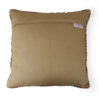 The back view of the tan velvet cushion showing the secure hidden flap and brand label.
