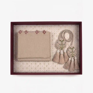 Gulnaz gift set in beige in a flat lay showing the folded runner with rose motif border alongside two embroidered tiebacks with beaded tassels in a maroon box
