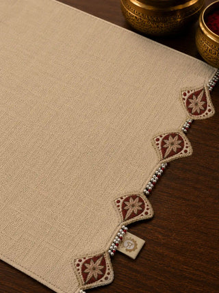 A high-resolution close-up macro view focusing on the maroon floral diamond embroidery, ivory seed pearls, and ruby beads of the Gulnaz mat.