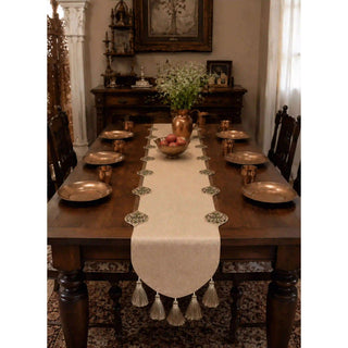 Gulnaz Table Runner with copper plates, tumblers and a brass water pitcher on a formal dining table setting