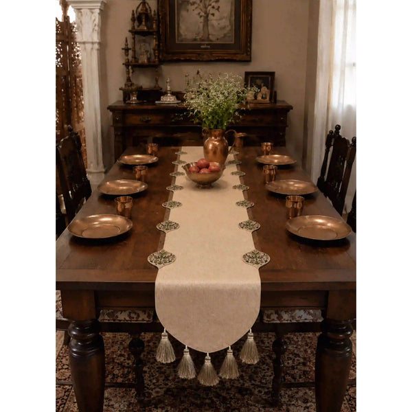 Gulnaz Table Runner with copper plates, tumblers and a brass water pitcher on a formal dining table setting