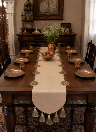 Gulnaz Table Runner with copper plates, tumblers and a brass water pitcher on a formal dining table setting