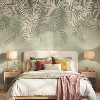 The Hanging Tropical Leaves botanical wallpaper styled behind a plush upholstered bed in a serene, luxury bedroom view-bedroom