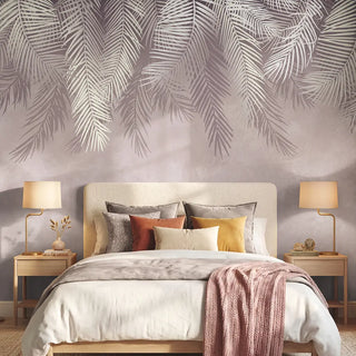 The Hanging Tropical Leaves botanical wallpaper in pink styled behind an upholstered bed in a serene luxury bedroom  view-bedroom