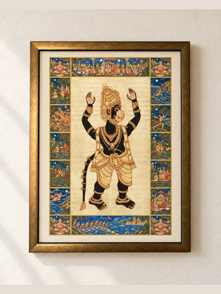Hanuman Ansh framed wall art in a wooden antique-gold frame with an ivory mount, hung on a cream wall in soft window light.