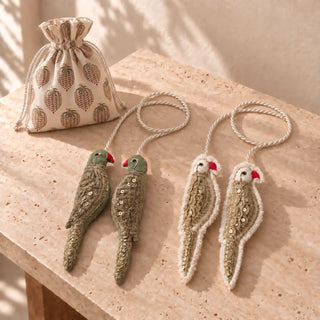 The Heer Ranjha tieback gift set in Sage & Ivory laid out beside its block-print drawstring gift pouch.