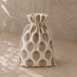 The block-print drawstring gift pouch included with the Heer Ranjha tieback gift set in Sage & Ivory.