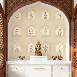 The Floral Radiance customized wallpaper providing a serene, sacred backdrop behind a brass Ganesha statue in a pooja room alcove.