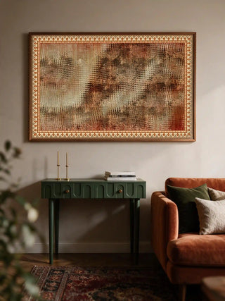 Horizontal Ikat Fusion Industrial poster displayed above a green console table paired with a rust velvet sofa in a living room.