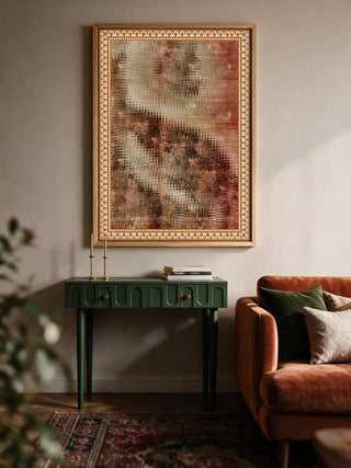 Vertical Ikat Fusion Industrial wall art poster mounted above a green console table next to a velvet armchair.