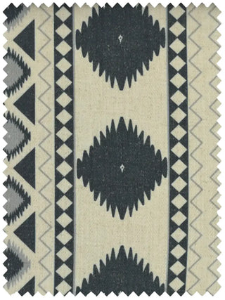 A high-resolution swatch of Ikkat Geometric fabric featuring charcoal black diamonds and zig-zags on a cream textured ground.