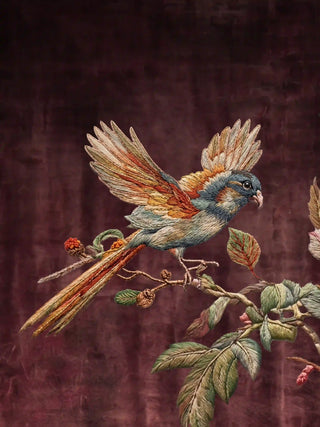 Close-up of a hand-illustrated songbird perched on a flowering branch in the Imperial Garden design