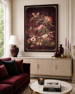 Framed Imperial Garden wall art above a cream console beside a burgundy velvet sofa in a bright living room