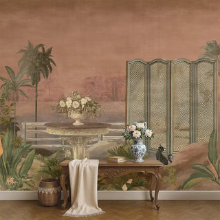 A peach-toned tropical wallpaper featuring palm trees, a stone table with a floral arrangement, and a black cat near a decorative screen, styled with classic wooden furniture.