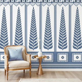 Indigo Grove Mural Wallpaper: Full wall installation of the indigo blue and white mural with giant leaf pillars in a living room.