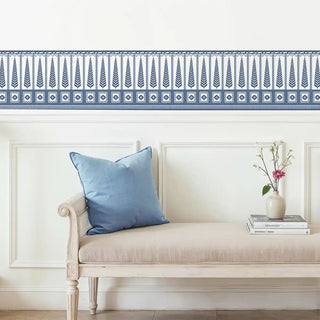 Indigo Grove Wallpaper: Blue and white decorative border installed above white wainscoting in a bright room.