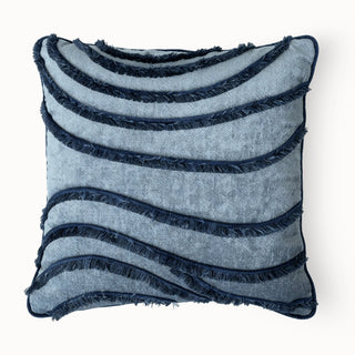 Full studio shot of the Indigo Wave Cushion with blue and navy fringed wave pattern.