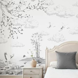 A luxury bedroom featuring the Indigo Whisper charcoal mural behind a bed with a grey accent cushion.