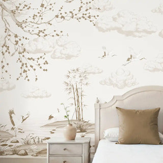 The Indigo Whisper sepia mural styled in a luxury living room behind a neutral sofa and tan cushions.