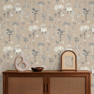 Wallpaper with nature-themed design featuring plants and animals on a beige background, displayed in a room with a wooden cabinet.