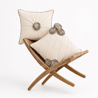 Ivory Gardenia Pleated Rosette and Draped Floral cushion covers on a rattan folding chair, ivory pleats with grey rosettes