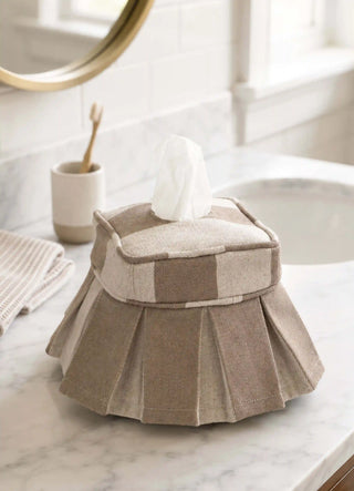 The Izel tissue case in Taupe, view-bathroom beside a sink and toothbrush cup.