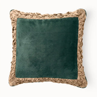 Front view of the Jhalak cushion cover featuring an emerald green velvet center and peach ruffled border.