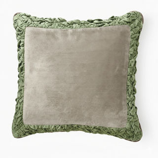 Front view of the Jhalak cushion cover featuring an ivory velvet center and sage green ruffled border.