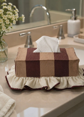 The Juliet tissue case in Wine & Camel, view-bathroom on a marble double-sink counter.
