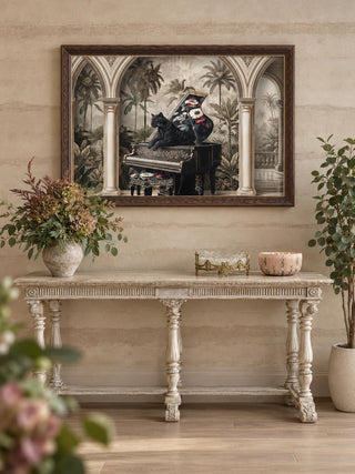The Jungle Noir embroidered wall art in a dark wood frame above a distressed cream carved console with hydrangeas and a gilt dish.
