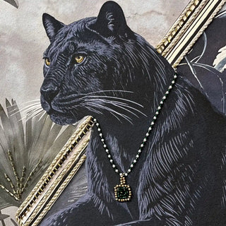 High-resolution detail of the gold beadwork and metallic corded scrollwork on the piano in the Jungle Noir wall art.