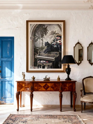 Large Jungle Noir wall art framed above a classical wood console table with a black lamp and vintage mirrors in a bright foyer