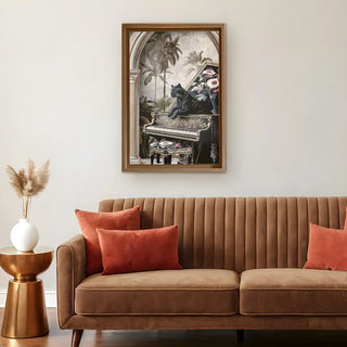 Living room with a brown sofa, red cushions, and a framed jungle noir embroidered artwork by life n colors