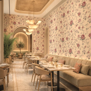 Elegant restaurant interior with floral wallpaper, tables, chairs, and a couch. view-restaurants