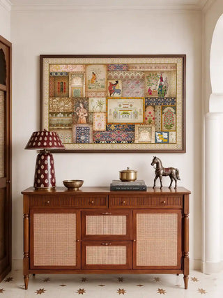 The Kahani Indian Art Theme horizontal wall art framed above a wooden cane sideboard styled with a brass horse and lamp.